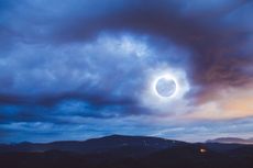 A total solar eclipse over the Blue Ridge Mountains.